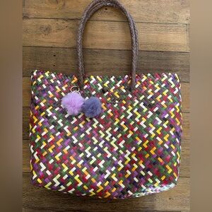 Colorful Woven Tote Bag with Pom Poms keychains made out of recycled plastic
